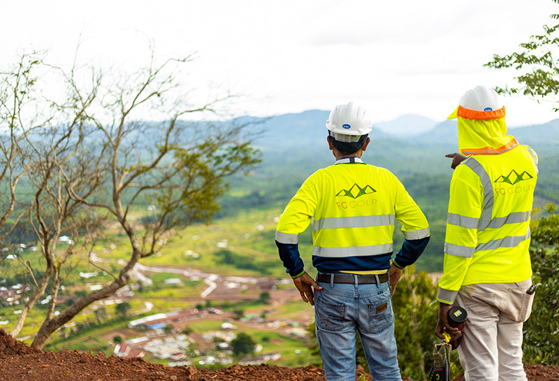 Two FG Gold & Diamond staff members looking over a mountain